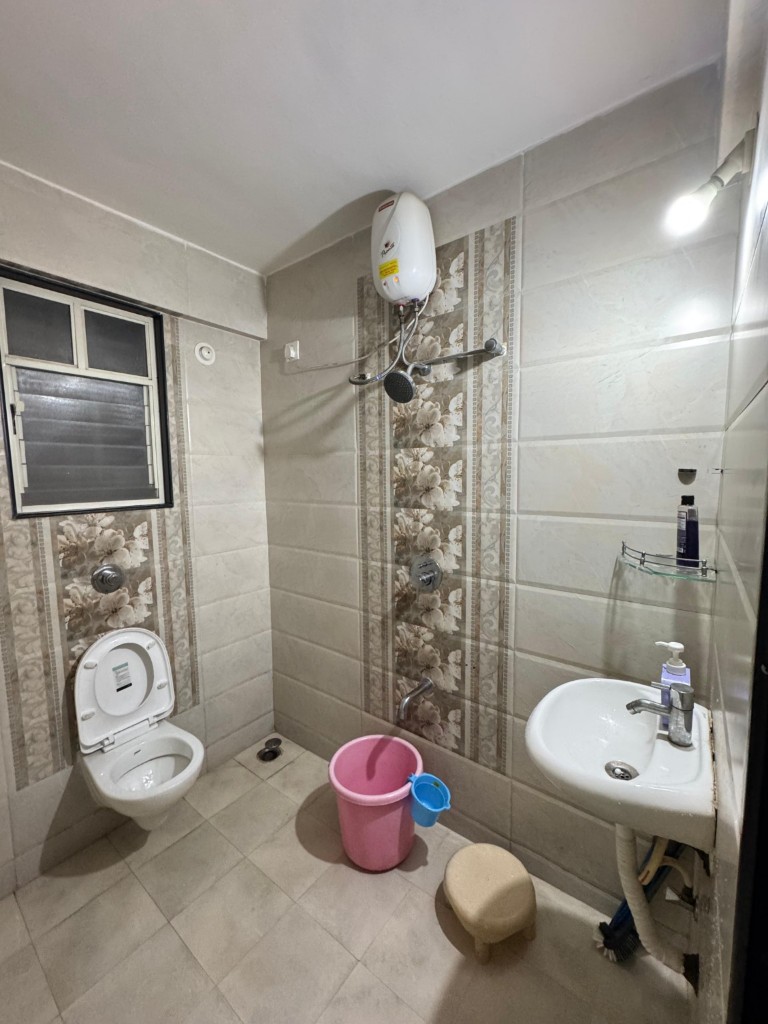 Bathroom with geyser, shower and washbasin