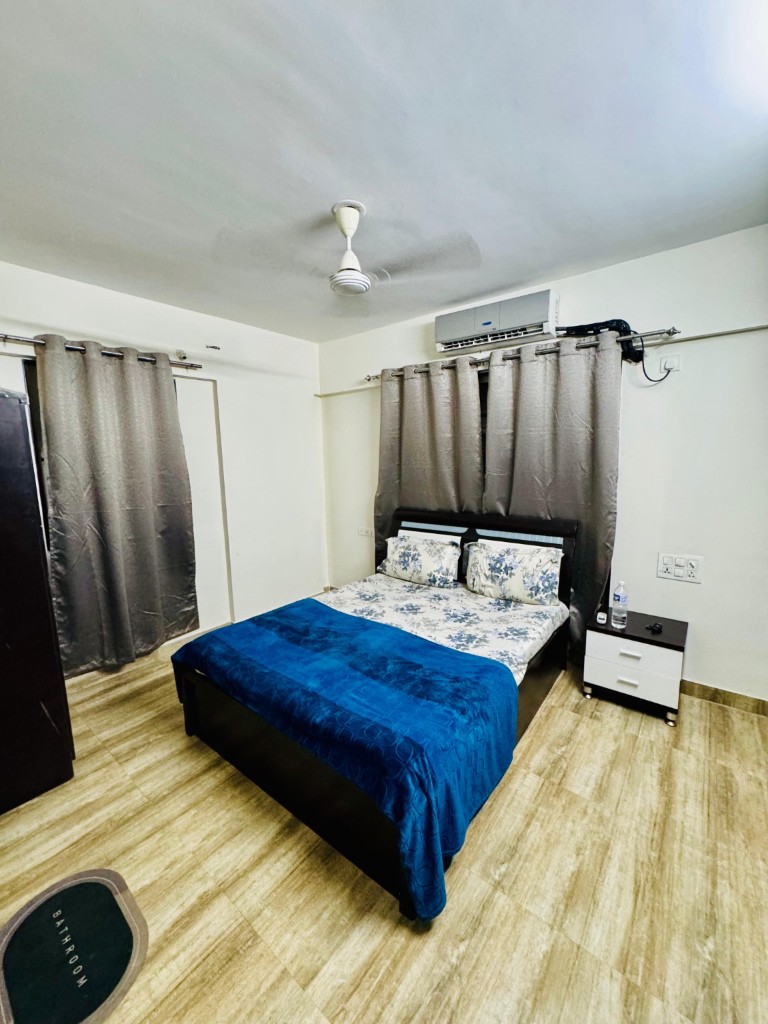 Primary bedroom with air conditioning and ensuite access