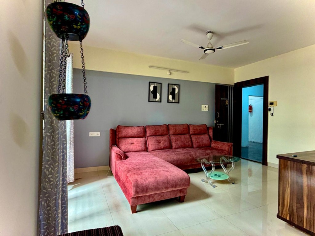 Lounge seating against a soft grey wall